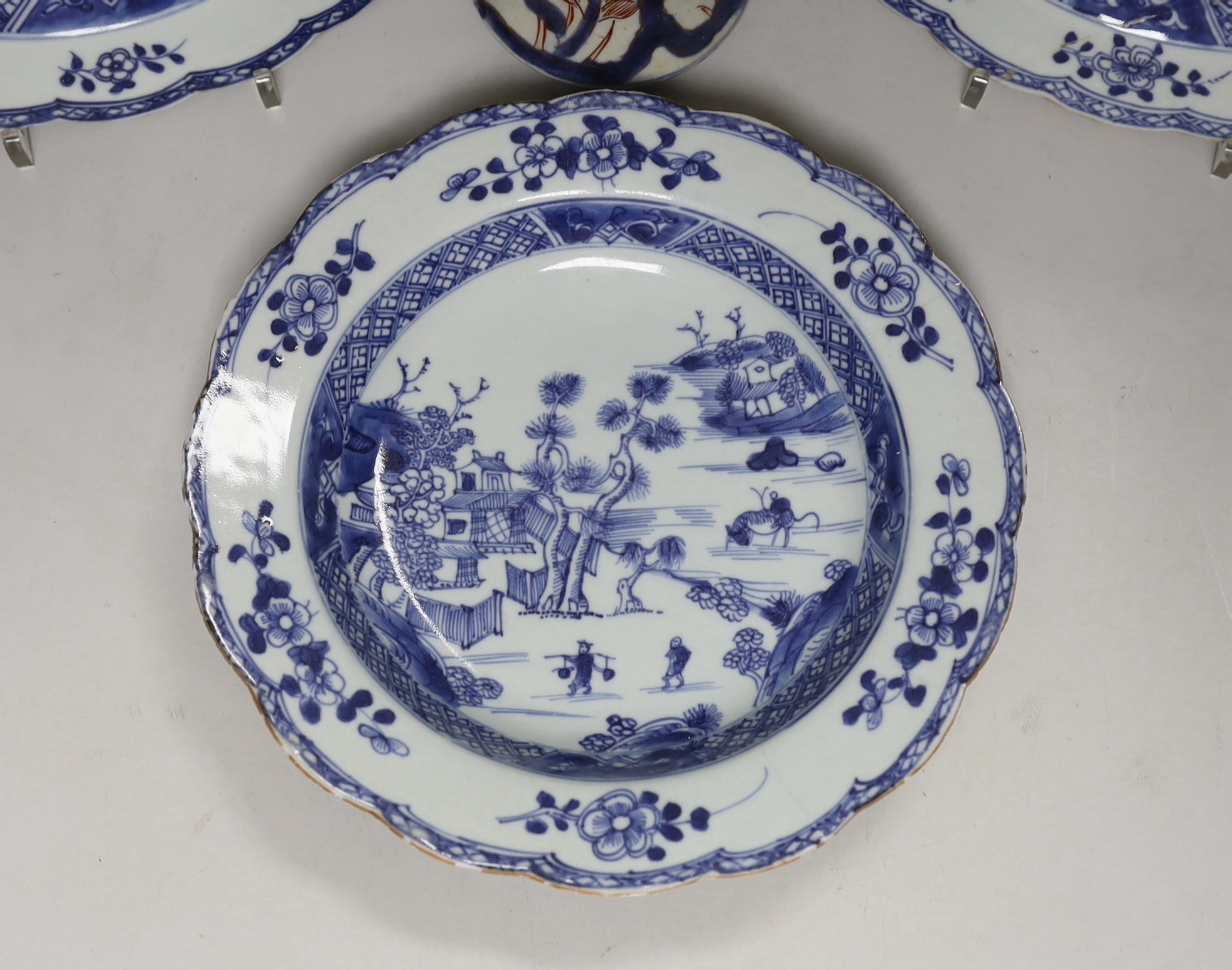 Three 18th century Chinese blue and white plates and an Imari flared vase, 22cm